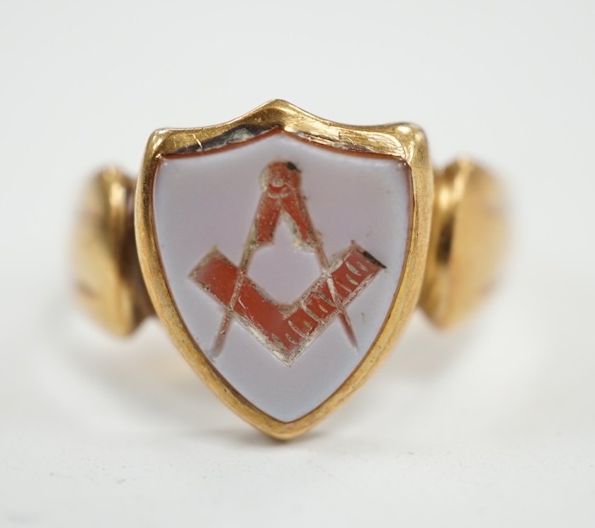 A late Victorian 18ct gold and sardonyx set shield shaped Masonic signet ring, size Q/R, gross weight 5 grams. Condition - fair